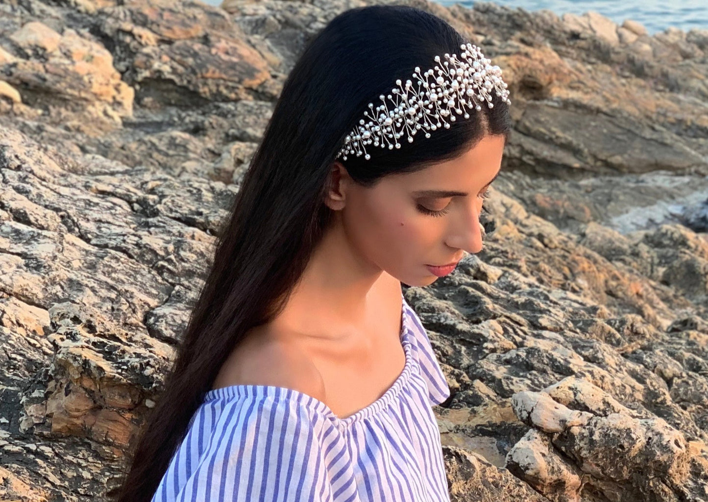 Model showcasing the timeless elegance of the Hailey headband, crafted exclusively with pearls