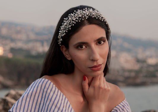 Model showcasing the timeless elegance of the Hailey headband, crafted exclusively with pearls.