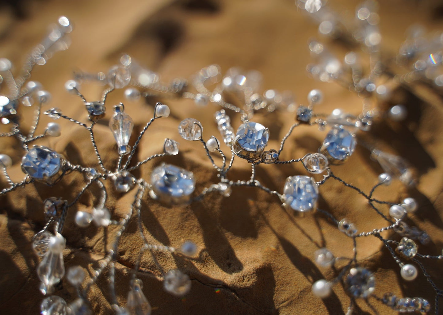 Close-up image showcasing the  details of the Amelia headpiece, crafted with silver Swarovski, white pearls, and clear crystals.