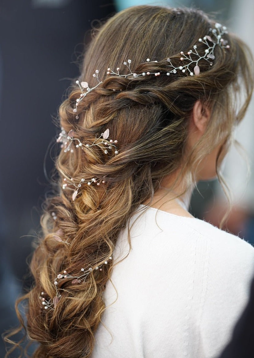 Model wearing the RAYAN hair vine, crafted with pearls, leaves, and crystal accents.